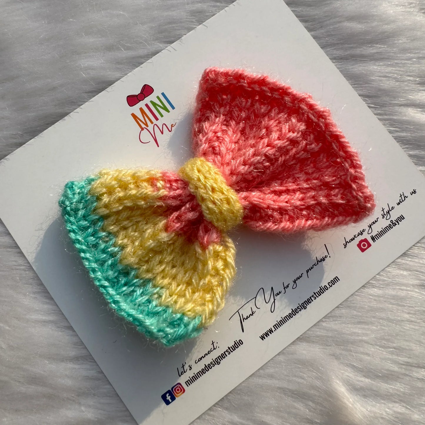 Pink, yellow, and aqua multicolor knitted hair bow clip