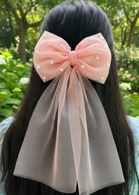 Large pink bow with pearl details