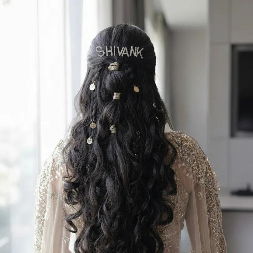 Bride wearing personalised crystal name hair pins with a pink bridal outfit