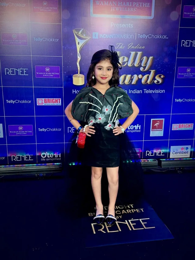 Vrihi Kodvara wearing a black fascinator at the Telly Awards