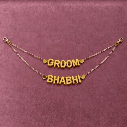 Gold acrylic double drape hair chain with groom and bhabhi bridal styling